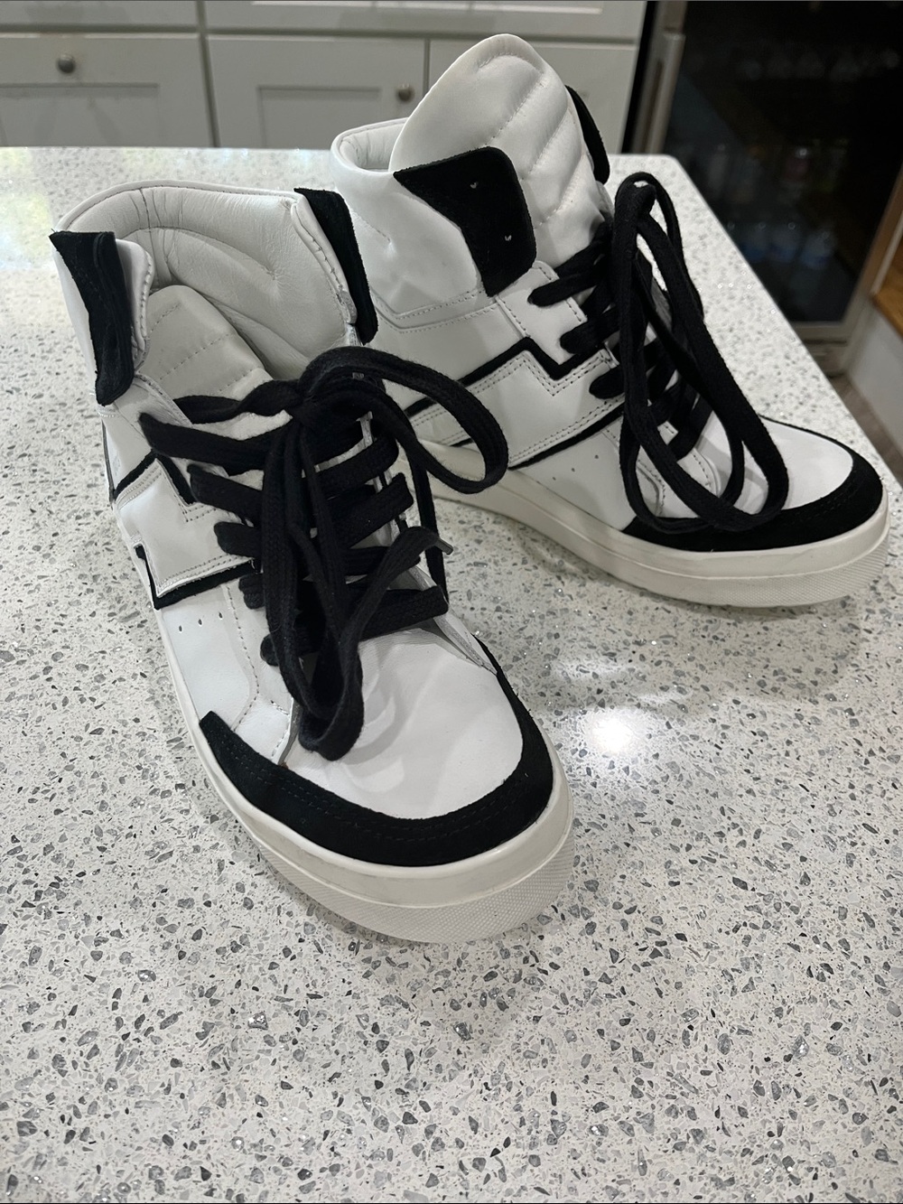 Cinzia Araia White High-Top Sneakers with Black Accents